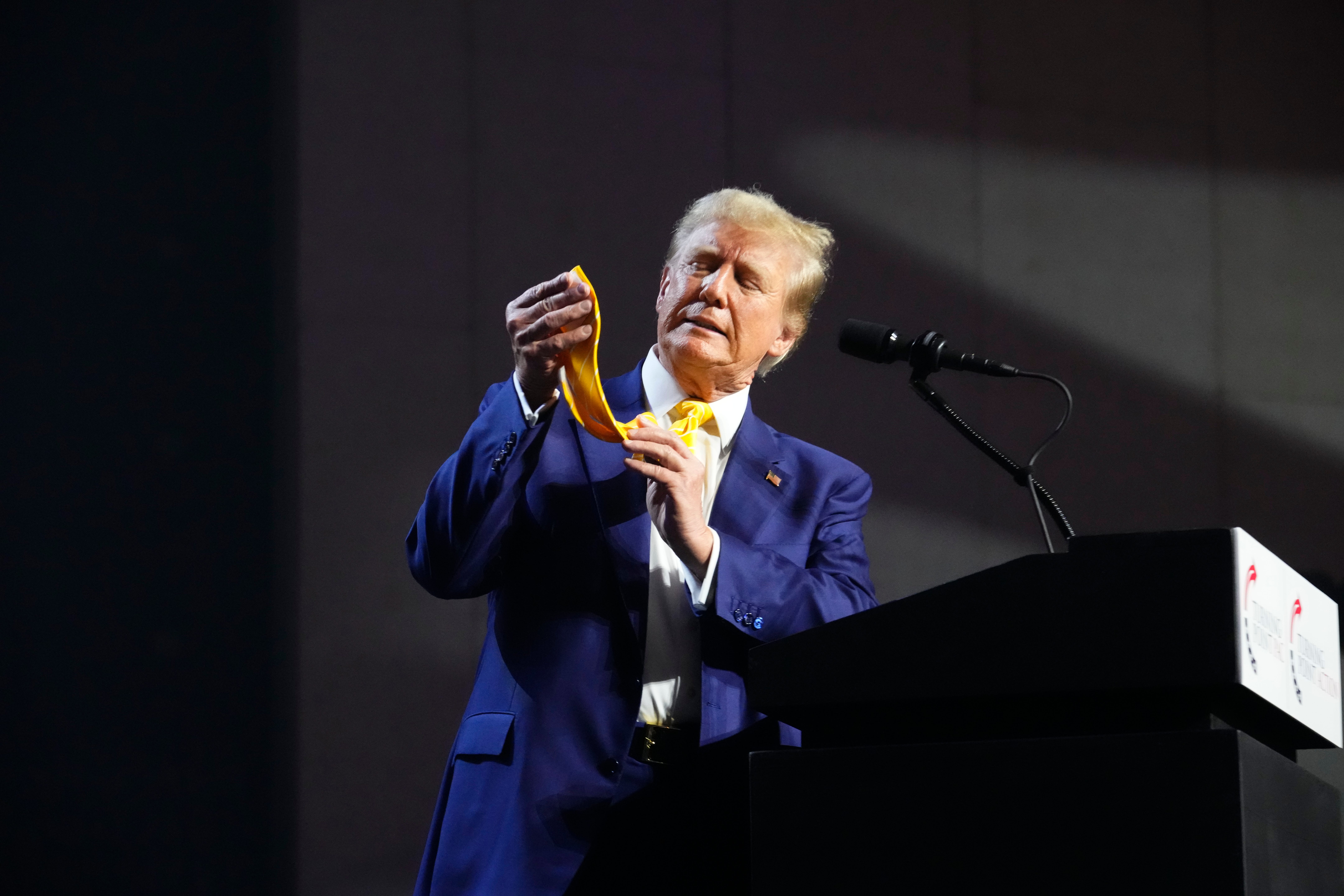 Donald Trump comments on his yellow tie during an appearance at a town hall meeting in Phoenix, Arizona
